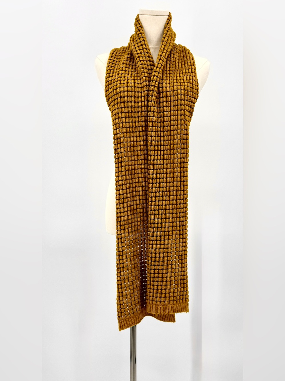 Extra long knit scarf in mustard yellow.